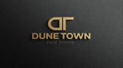 DUNE TOWN REAL ESTATE L.L.C logo image