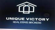 Unique Victory Real Estate Brokers logo image