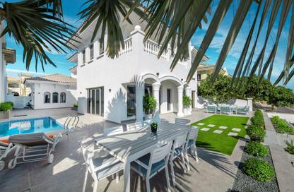 Villa - 5 Bedrooms - 7 Bathrooms for rent in Garden Homes Frond E - Garden Homes - Palm Jumeirah - Dubai