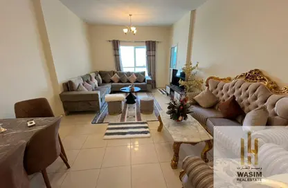 شقة - غرفة نوم - 2 حمامات للايجار في أورينت تاور 1 - أورينت تاور - البستان - عجمان