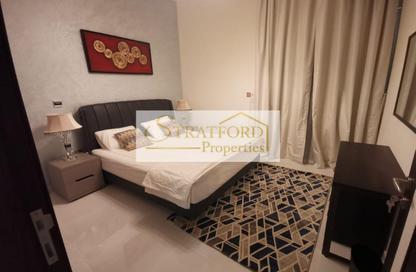Apartment - 1 - 2 for sale in Miraclz Tower by Danube - Arjan - Dubai