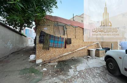 أرض - استوديو للبيع في بناية الشرفاء 1 - الرميلة 1 - عجمان