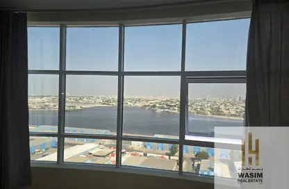 شقة - غرفة نوم - 2 حمامات للايجار في أورينت تاور 1 - أورينت تاور - البستان - عجمان