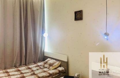 Apartment - 2 Bedrooms - 3 Bathrooms for sale in Orient Towers - Al Bustan - Ajman