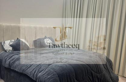 Apartment - 1 - 2 for sale in Lilies Tower - Emirates City - Ajman