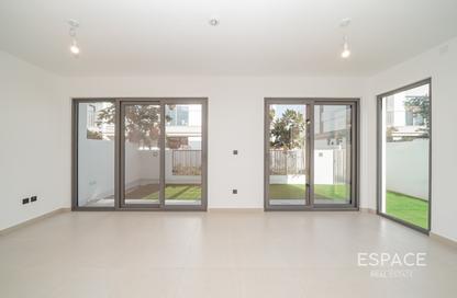 Villa - 4 - 5 for rent in Aura Gardens - Tilal Al Ghaf - Dubai