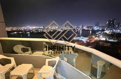 شقة - غرفة نوم - 2 حمامات للايجار في أورينت تاور 1 - أورينت تاور - البستان - عجمان