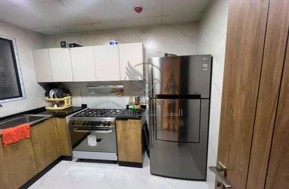 Apartment - 2 Bedrooms - 2 Bathrooms for rent in SRS Tower - Al Rashidiya 1 - Al Rashidiya - Ajman