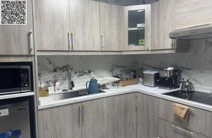Apartment - 1 - 2 for sale in Lilies Tower - Emirates City - Ajman