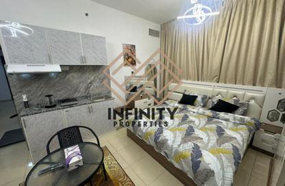 Apartment - 2 Bedrooms - 3 Bathrooms for sale in Orient Tower 1 - Orient Towers - Al Bustan - Ajman