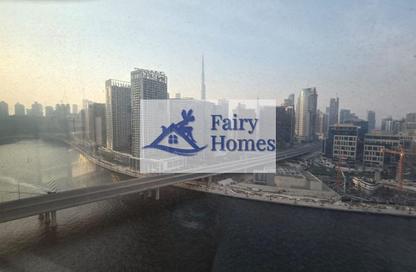 Apartment - 1 - 1 for sale in Mayfair Residency - Business Bay - Dubai