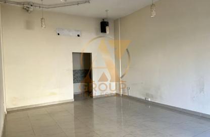 Shop - Studio for rent in Building V02 - Russia Cluster - International City - Dubai