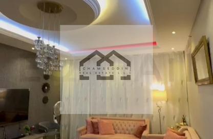 Apartment - 2 Bedrooms - 2 Bathrooms for sale in Orient Tower 1 - Orient Towers - Al Bustan - Ajman