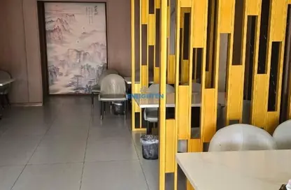 متجر - استوديو للايجار في ك 16 - طراز يوناني - المدينة العالمية - دبي