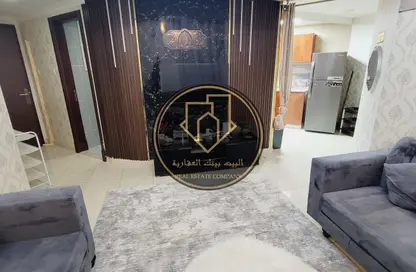 شقة - غرفة نوم - 2 حمامات للبيع في أورينت تاور 1 - أورينت تاور - البستان - عجمان