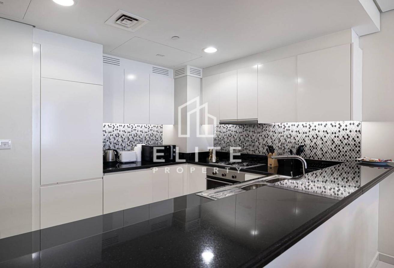 High Floor 2BHK | Infinity Pool and Burj Views photo 17