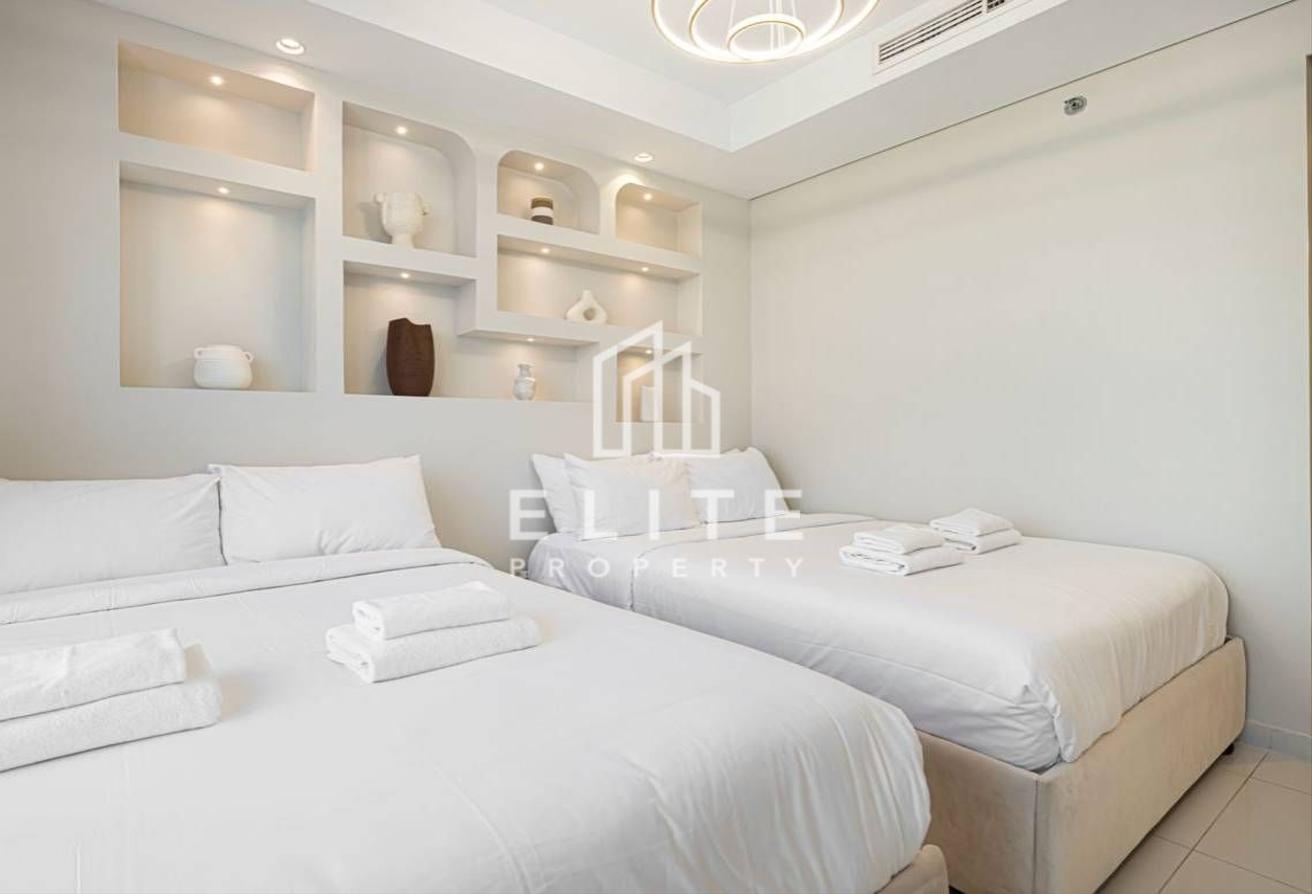 High Floor 2BHK | Infinity Pool and Burj Views photo 7