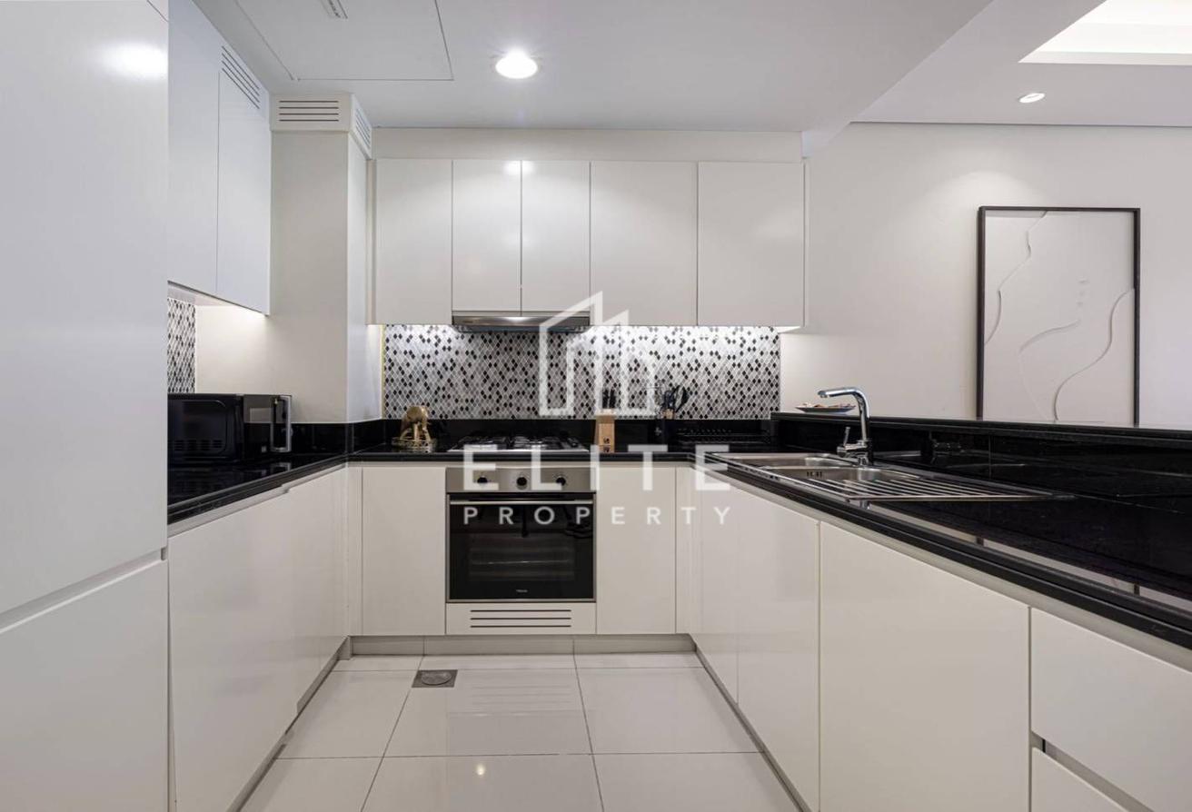 High Floor 2BHK | Infinity Pool and Burj Views photo 10