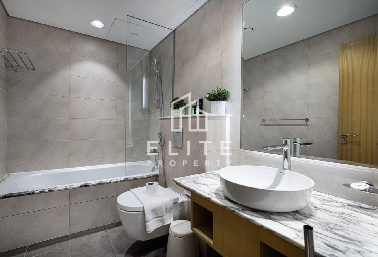 High Floor 2BHK | Infinity Pool and Burj Views photo 25