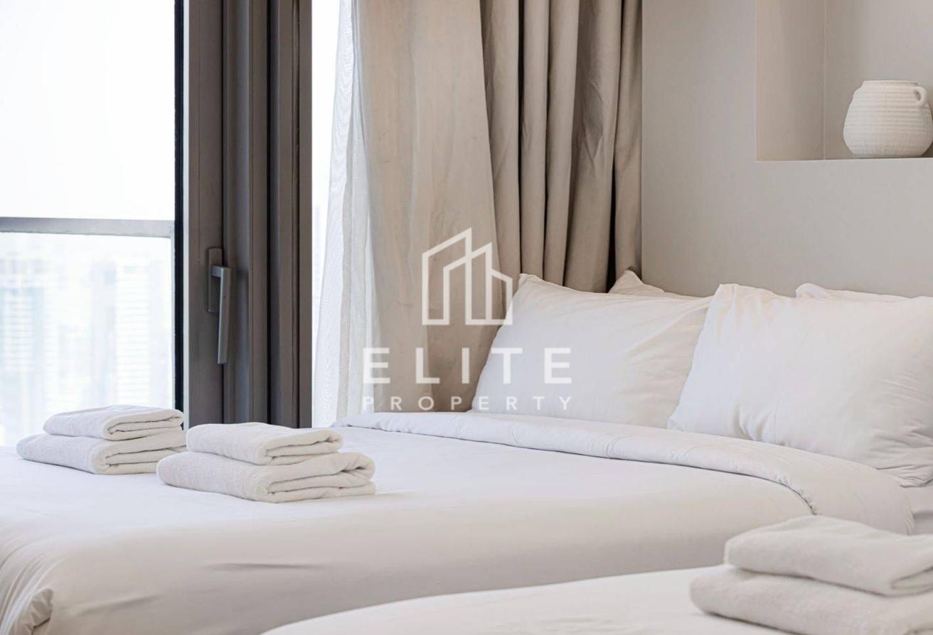 High Floor 2BHK | Infinity Pool and Burj Views photo 13