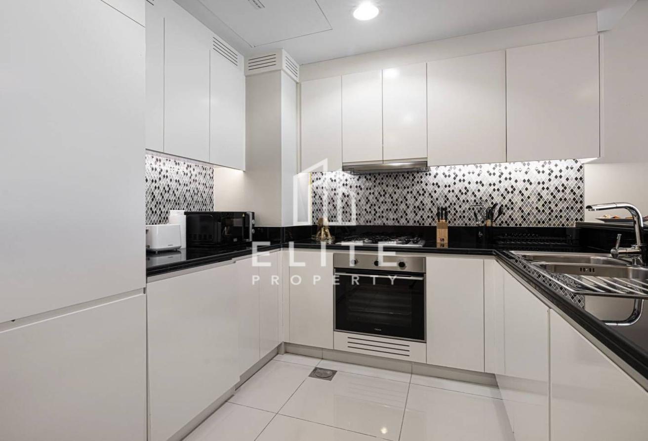 High Floor 2BHK | Infinity Pool and Burj Views photo 14