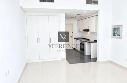 Apartment - Studio - 1 for sale in Golf Promenade 3A - Golf Promenade 3 - Golf Town - Damac Hills - Dubai