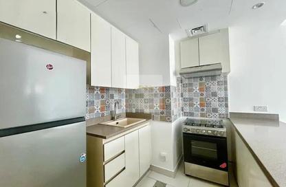 Apartment - 1 Bedroom - 2 Bathrooms for rent in Rabdan Building - Motor City - Dubai