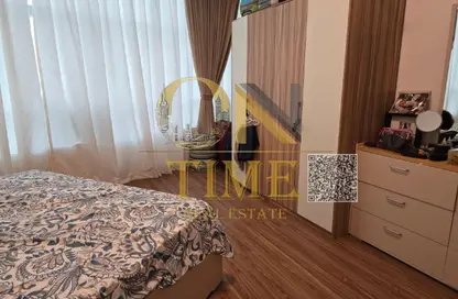 Apartment - 2 Bedrooms - 2 Bathrooms for sale in Orient Tower 1 - Orient Towers - Al Bustan - Ajman