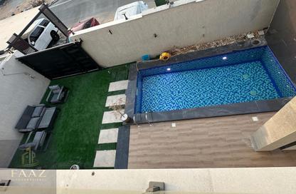 Villa - 4 Bedrooms - 5 Bathrooms for sale in Al Helio - Ajman