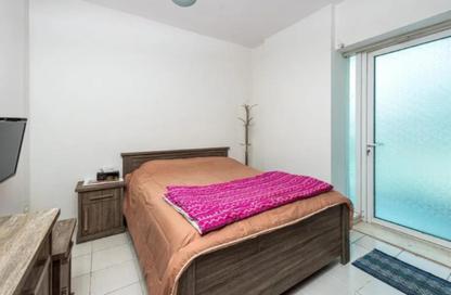 Apartment - 1 Bedroom - 2 Bathrooms for sale in Cricket Tower - Dubai Sports City - Dubai
