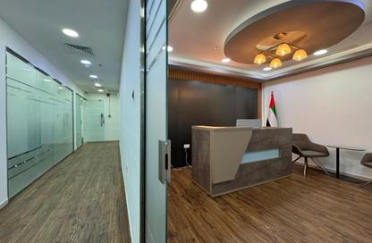 Half Floor - Studio - 3 Bathrooms for rent in Hamdan Street - Abu Dhabi