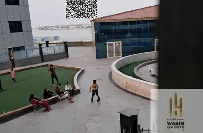 شقة - غرفة نوم - 2 حمامات للبيع في أورينت تاور 1 - أورينت تاور - البستان - عجمان