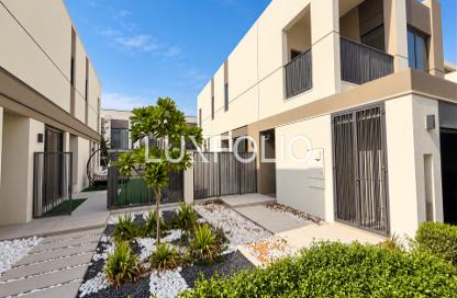 Townhouse - 4 - 4 for sale in Aura Gardens - Tilal Al Ghaf - Dubai