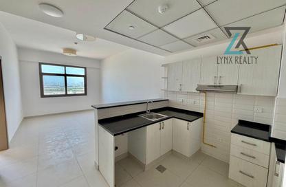 Apartment - 1 - 2 for rent in Al Waleed Building - International City - Dubai
