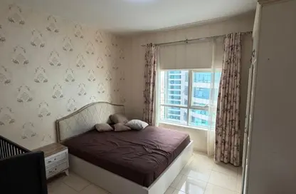 شقة - غرفة نوم - 2 حمامات للايجار في أورينت تاور 1 - أورينت تاور - البستان - عجمان