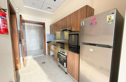 Apartment - Studio - 1 for rent in National Bonds Residence - District 15 - Jumeirah Village Circle - Dubai