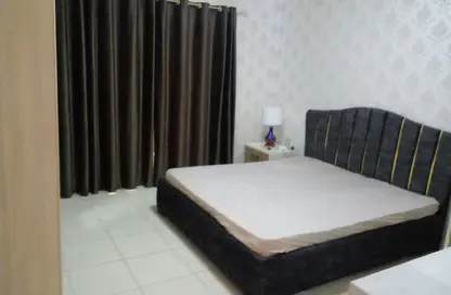 شقة - غرفة نوم - 2 حمامات للايجار في أورينت تاور 1 - أورينت تاور - البستان - عجمان