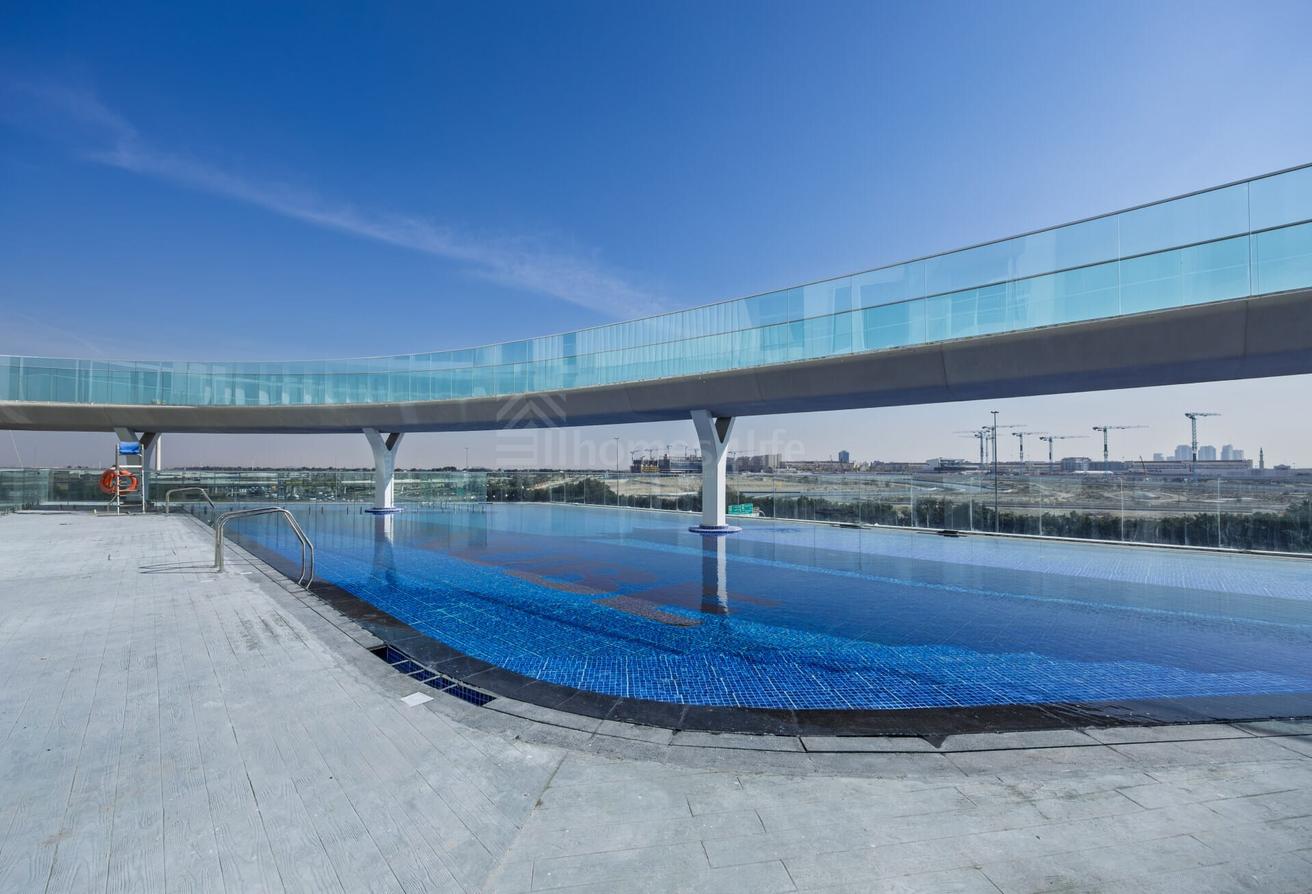 Corner Unit | Brand New | Pool & road view photo 10