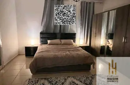 شقة - غرفة نوم - 2 حمامات للبيع في أورينت تاور 1 - أورينت تاور - البستان - عجمان