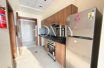 Apartment - Studio - 1 for rent in National Bonds Residence - District 15 - Jumeirah Village Circle - Dubai