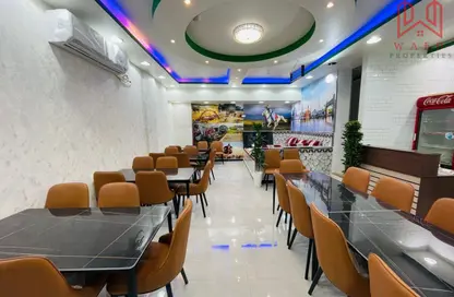 متجر - استوديو - 1 حمام للإيجار في واي07 - طراز إنجليزي - المدينة العالمية - دبي