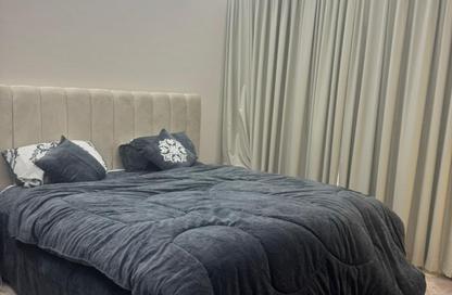 Apartment - 1 - 2 for sale in Smart Tower 1 - Al Amerah - Ajman