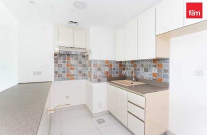 Apartment - 1 - 2 for sale in Rabdan Building - Motor City - Dubai