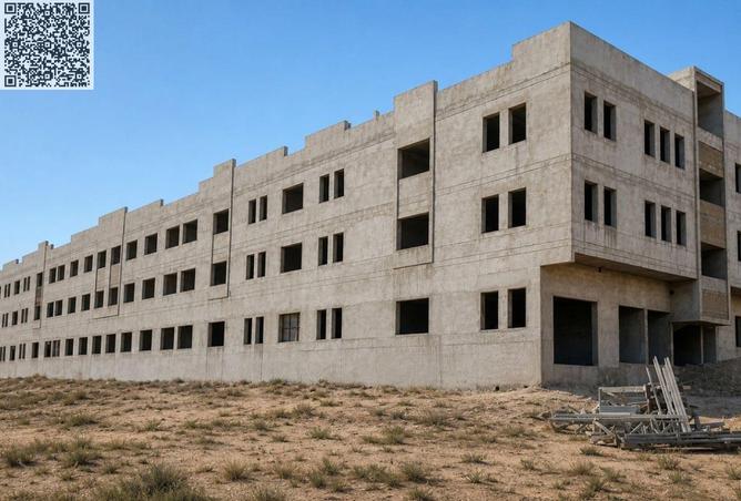 Two-story building under construction in Al-Jarf