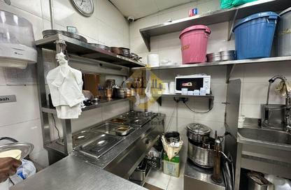 Retail - Studio - 1 Bathroom for rent in Al Habbai Karama Building - Al Karama - Dubai