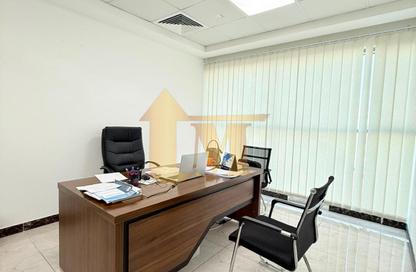 Office Space - Studio - 1 Bathroom for rent in Indigo Optima - Indigo Towers - International City - Dubai