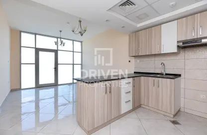 Apartment - 1 Bedroom - 2 Bathrooms for sale in Chaimaa Premiere - District 15 - Jumeirah Village Circle - Dubai