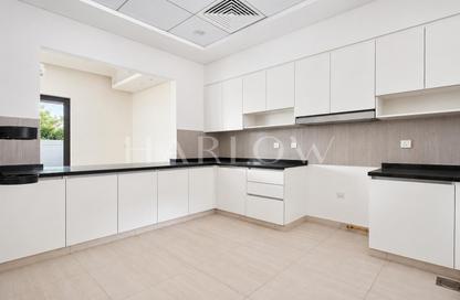 Townhouse - 4 - 5 for sale in Sevilla Village - Victory Heights - Dubai Sports City - Dubai