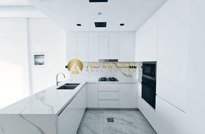 Apartment - 1 - 2 for sale in Samana Santorini - Dubai Studio City - Dubai