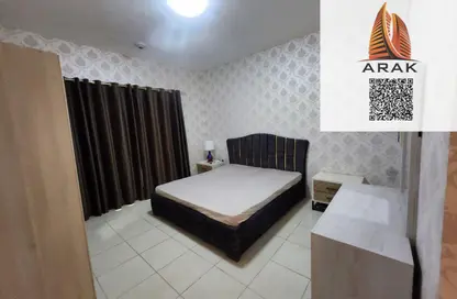 شقة - غرفة نوم - 2 حمامات للايجار في أورينت تاور 1 - أورينت تاور - البستان - عجمان